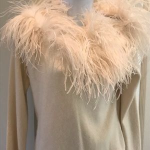 Party sweater with feathers